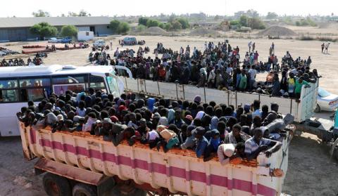 Migrants ride in truck before they are transported to a detention center, in the coastal city of Sabratha, Libya, October 7, 2017. PHOTO BY REUTERS/Hani Amara