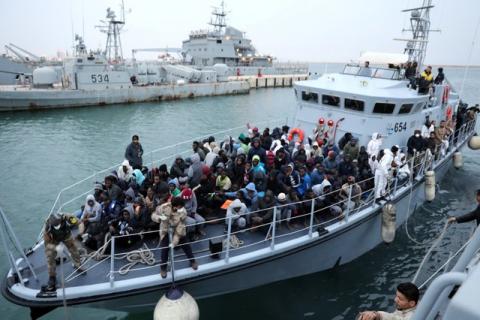 Migrants in a boat arrive at a naval base after they were rescued by Libyan coast guards, in Tripoli, Libya, January 9, 2018. PHOTO BY REUTERS/Hani Amara