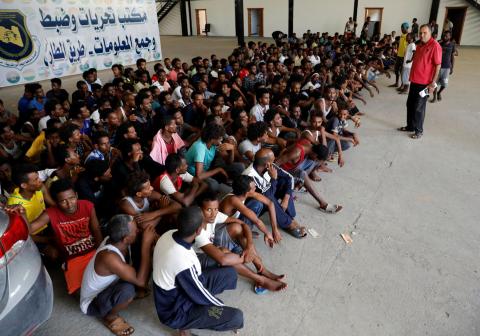 Migrants are seen in a shelter after they were relocated from government-run detention centers, after getting trapped by clashes between rival groups in Tripoli, Libya, August 30, 2018. PHOTO BY REUTERS/Hani Amara