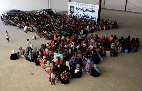 Migrants are seen in a shelter after they were relocated from government-run detention centers, after getting trapped by clashes between rival groups in Tripoli, Libya, August 30, 2018. PHOTO BY REUTERS/Hani Amara