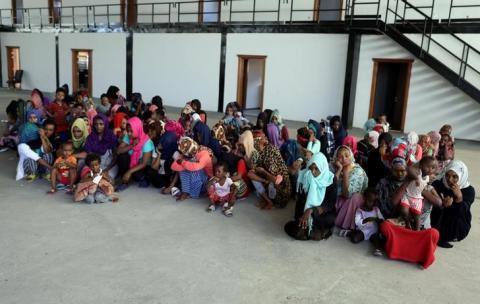 Migrants are seen in a shelter after they were relocated from government-run detention centers, after getting trapped by clashes between rival groups in Tripoli, Libya, August 30, 2018. PHOTO BY REUTERS/Hani Amara