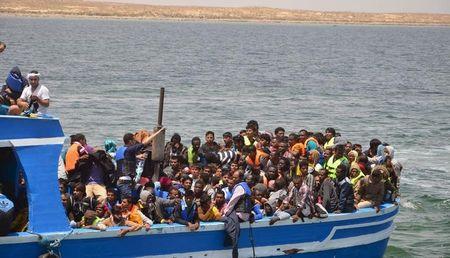 Illegal migrants seen on a boat after being rescued by the Tunisian navy off the coast near Ben Guerdane, Tunisia, June 10, 2015. PHOTO BY REUTERS/Stringer