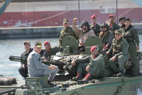 Venezuela's President Nicolas Maduro and his wife Cilia Flores are seen atop a military vehicle during a military exercise in Puerto Cabello, Venezuela, January 27, 2019. PHOTO BY REUTERS/Miraflores Palace