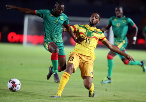 Mali's Molla Wague in action with Mauritania's Ismael Diakite. PHOTO BY REUTERS/Suhaib Salem