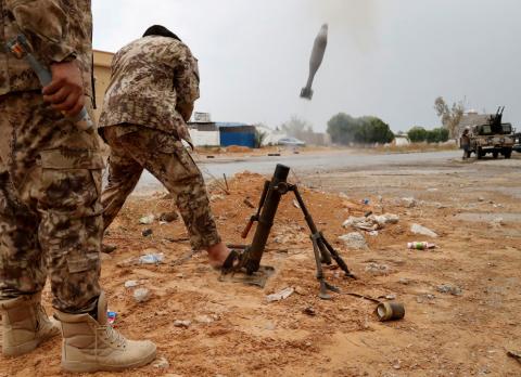 A fighter loyal to Libya's U.N.-backed government (GNA) fires a mortar during clashes with forces loyal to Khalifa Haftar on the outskirts of Tripoli, Libya, May 25, 2019. PHOTO BY REUTERS/Goran Tomasevic