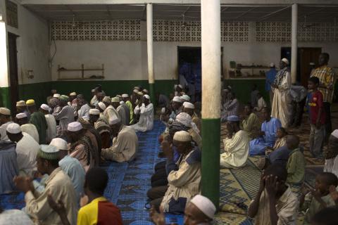 Men and children pray in a mosque near Kilometre 12 (PK12) where internally displaced muslims are stranded due to the ongoing sectarian violence in the capital Bangui