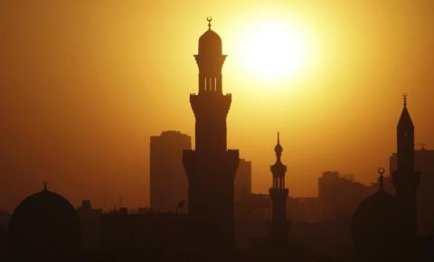 The sun sets over the minarets of mosques on the 12th day of the holy fasting month of Ramadan, in Old Cairo