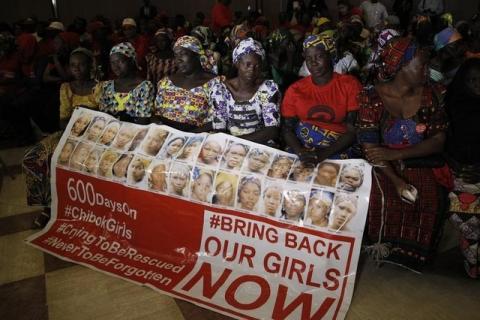 Parents of the Chibok girls hold a "Bring Back Our Girls" banner during their meeting with Nigeria's President Muhammadu Buhari at the presidential villa in Abuja, Nigeria, January 14, 2016. PHOTO BY REUTERS/Afolabi Sotunde