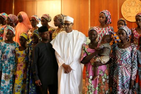 Some of the 21 Chibok schoolgirls released by Boko Haram pose during a group photograph with President Muhammadu Buhari and Vice President Yemi Osinbajo In Abuja, Nigeria, October 19, 2016. PHOTO BY REUTERS/Afolabi Sotunde