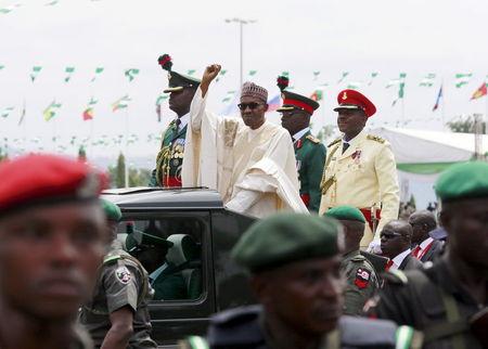 Nigeria's new President Muhammadu Buhari rides in a motorcade while inspecting the guard of honour at Eagle Square in Abuja, Nigeria, May 29, 2015. PHOTO BY REUTERS/Afolabi Sotunde