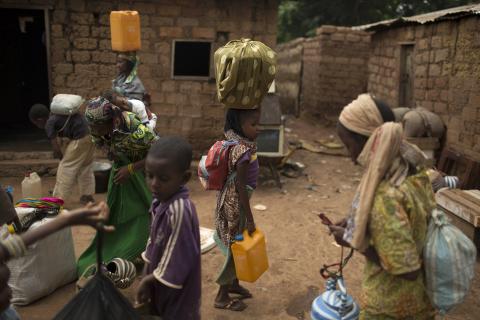 Muslim families prepare to be evacuated by road, with the help of an armed convoy escorted by African Union peacekeepers, near the PK12 neighborhood in Bangui