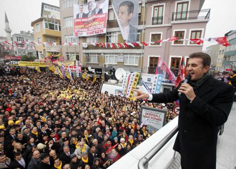 Mustafa Sarigul greets his supporters during a rally in Istanbul