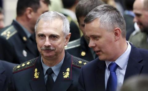 Acting Ukrainian Defense Minister Mykhailo Koval listens to Polish Defence Minister Tomasz Siemoniak (R) during a NATO defence ministers meeting at the Alliance headquarters in Brussels, June 3, 2014. PHOTO BY REUTERS/Francois Lenoir