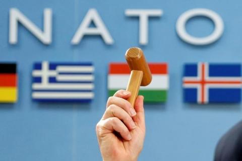 NATO Secretary-General Jens Stoltenberg holds up a ceremonial hammer at the start of a NATO-Georgia defence ministers meeting at the Alliance headquarters in Brussels, Belgium February 16, 2017. PHOTO BY REUTERS/Francois Lenoir