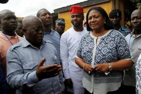 Ghanaian presidential candidate Nana Akufo-Addo (L) of the opposition New Patriotic Party (NPP) talks next to his wife Rebecca after casting his vote at a polling station in Kibi, Ghana, December 7, 2016. PHOTO BY REUTERS/Luc Gnago