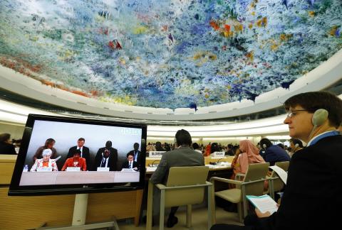 An unidentified delegate listens to U.N. High Commissioner for Human Rights Navi Pillay speak during the 26th session of the Human Rights Council at the United Nations in Geneva