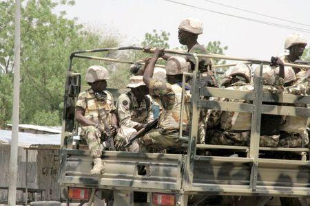 Soldiers are seen on a truck in Maiduguri in Borno State, Nigeria May 14, 2015. PHOTO BY REUTERS/Stringer