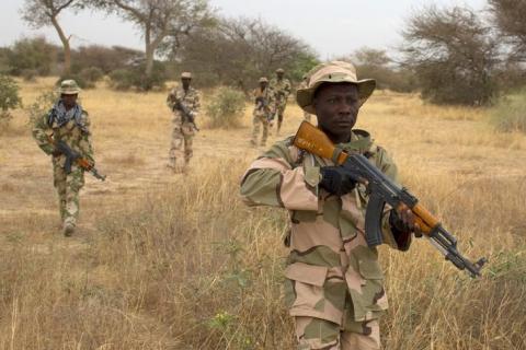 Nigerian soldiers walk in a line during Flintlock 2014, a U.S.-led international training mission for African militaries, in Diffa, March 3, 2014. PHOTO BY REUTERS/Joe Penney