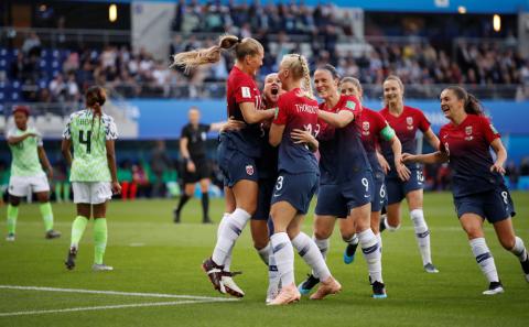 Norway's Guro Reiten celebrates scoring their first goal with Isabell Herlovsen and team mates. PHOTO BY REUTERS/Christian Hartmann