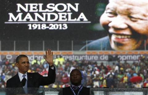 U.S. President Barack Obama addresses the crowd during a memorial service for Nelson Mandela at FNB Stadium in Johannesburg, South Africa