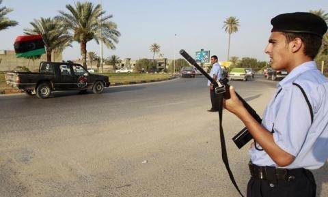 Libyan national security officers stand guard at a street in the rebel-held city of Misrata, file. PHOTO BY REUTERS/Thaier al-Sudani