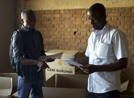 Officials of Burundi's National Electoral Commission take stock of electoral material for the upcoming parliamentary elections at a warehouse in the neighbourhood of Nyakabiga near the capital Bujumbura, June 28, 2015. PHOTO BY REUTERS/Paulo Nunes dos Santos