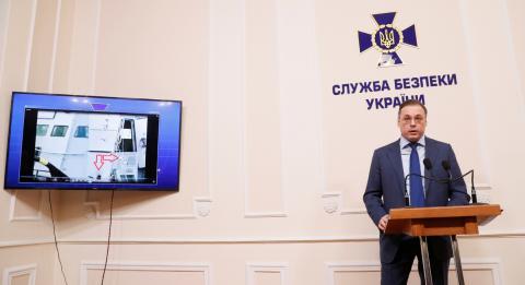 Deputy Head of Security Service of Ukraine, Oleh Frolov demonstrates an image showing Ukrainian armoured artillery vessel Berdyansk damaged by Russian shelling during a news conference on the Black Sea incident, which took place off Russian-annexed Crimea on November 25, in Kiev, Ukraine, November 29, 2018. PHOTO BY REUTERS/Valentyn Ogirenko