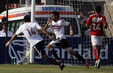 Zamalek's Omar Gaber (C) celebrates after scoring a goal against Al-Ahly during their CAF Champions League soccer match at El-Gouna stadium in Hurghada, about 464 km (288 miles) from the capital Cairo, September 15, 2013. PHOTO BY REUTERS/Amr Abdallah Dalsh