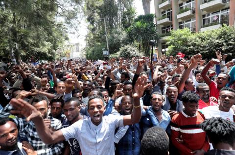 Oromo youth shout slogans outside Jawar Mohammed's house, an Oromo activist and leader of the Oromo protest in Addis Ababa, Ethiopia, October 23, 2019. PHOTO BY REUTERS/Tiksa Negeri