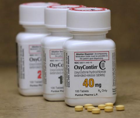 Bottles of prescription painkiller OxyContin pills, made by Purdue Pharma LP sit on a counter at a local pharmacy in Provo, Utah, U.S., April 25, 2017. PHOTO BY REUTERS/George Frey