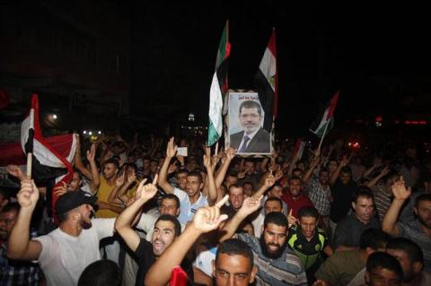 Palestinians rally in support of Mohamed Mursi