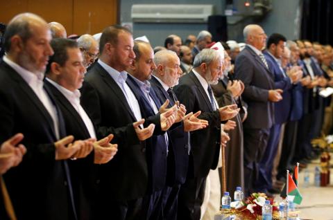 Palestinian parliament deputy speaker Ahmed Bahar of Hamas and senior Hamas leader Mahmoud al-Zahar attend the Palestinian National Popular Conference in Gaza City, April 29, 2018. PHOTO BY REUTERS/Mohammed Salem