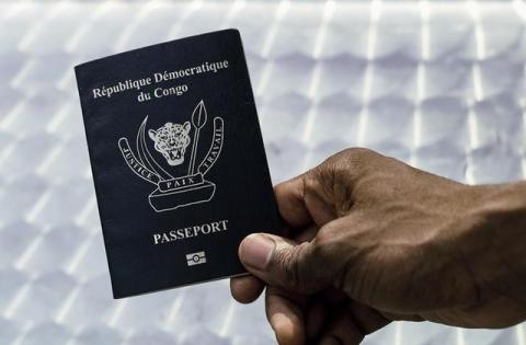 An immigration official displays a Congolese biometric passport in the Democratic Republic of Congo's capital Kinshasa, February 10, 2017. PHOTO BY REUTERS/Stringer