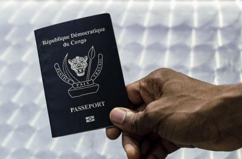 An immigration official displays a Congolese biometric passport in the Democratic Republic of Congo's capital Kinshasa, February 10, 2017. PHOTO BY REUTERS/Stringer