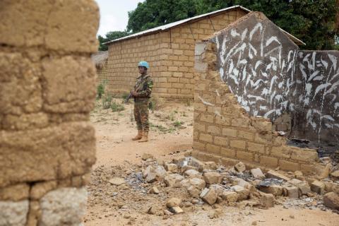 A Bangladeshi United Nations peacekeeping soldier stands among houses destroyed by violence in September, in the abandoned village of Yade, Central African Republic, April 27, 2017. PHOTO BY REUTERS/Baz Ratner