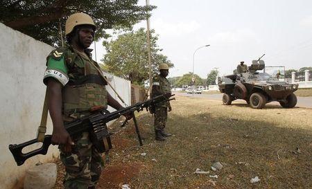 Members of the African peacekeeping forces stand in a street in Bangui, February 19, 2014. PHOTO BY REUTERS/Luc Gnago