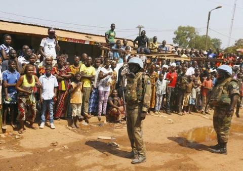 United Nations peacekeepers from Gabon stand alongside a road before the Pope Francis' arrival at the refugee camp of Saint Sauveur, in the capital Bangui, November 29, 2015. PHOTO BY REUTERS/Stefano Rellandini