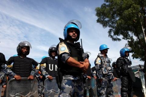 U.N. peacekeepers stand guard during a visit by U.N. Secretary-General Ban Ki-moon to an IDP (internally displaced persons) camp in the United Nations Mission In South Sudan (UNMISS) base in Juba, May 6, 2014. PHOTO BY REUTERS/Andreea Campeanu