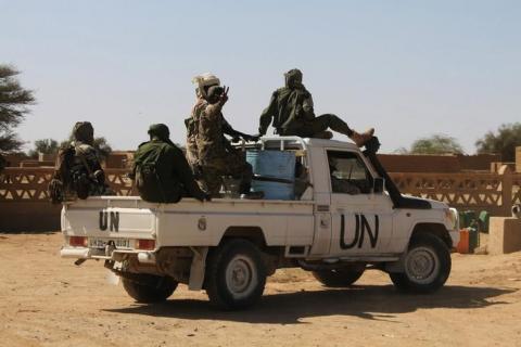 Chadian U.N. peacekeepers gesture as they patrol during a ceremony marking two years since Malian soldiers were killed in a massacre by radical Islamists, in Aguelhok, Mali