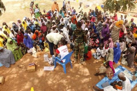 People who were rescued after being held captive by Boko Haram, sit as they wait for medical treatment at a camp near Mubi, northeast Nigeria, October 29, 2015. PHOTO BY REUTERS/Stringer
