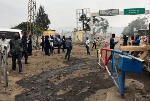 Congolese customs agents gather at the gate barriers at the border crossing point with Rwanda following its closure over ebola threat in Goma, eastern Democratic Republic of Congo, August 1, 2019. PHOTO BY REUTERS/Djaffer Sabiti