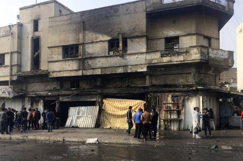 People gather at the scene of bomb attack in Baghdad, January 30, 2015. PHOTO BY REUTERS/Ahmed Saad