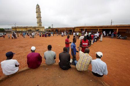 People wait for their turn to vote in the presidential election at a polling station in Gagnoa, in western Ivory Coast, October 25, 2015. PHOTO BY REUTERS/Thierry Gouegnon