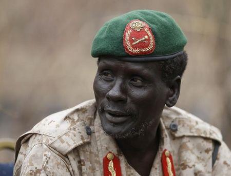 Rebel General Peter Gatdet Yaka talk to his comrades in a rebel-controlled territory in Jonglei State, February 1, 2014. PHOTO BY REUTERS/Goran Tomasevic