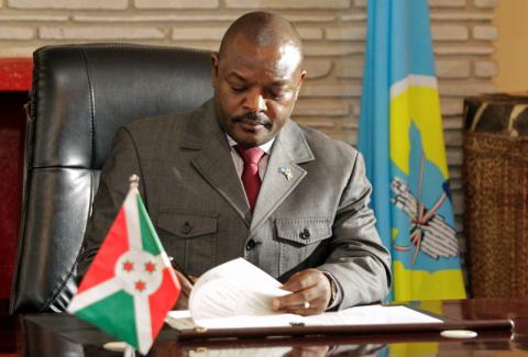 Burundi's President Pierre Nkurunziza signs the new constitution at the presidential palace in Gitega Province, Burundi, June 7, 2018. PHOTO BY REUTERS/Evrard Ngendakumana