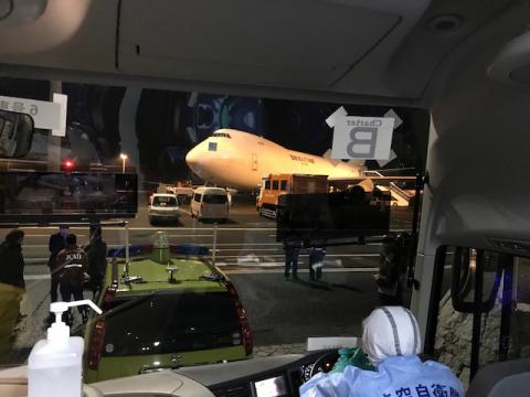 A chartered evacuation aircraft operated by Kalitta Air waits for U.S. passengers who have chosen to leave the Diamond Princess cruise ship, to fly back to the United States, at Haneda airport in Japan, February 17, 2020. PHOTO BY REUTERS/Courtesy of Philip and Gay Courter