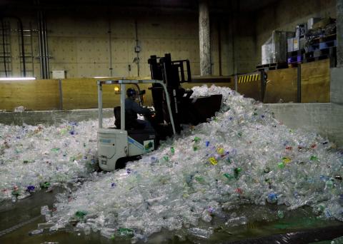 A forklift car carries PET bottles for recycling at Minato Resource Recycle Center in Tokyo, Japan June 10, 2019. PHOTO BY REUTERS/Kim Kyung-Hoon