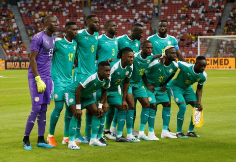 Senegal players pose for a team group photo before the match. PHOTO BY REUTERS/Feline Lim