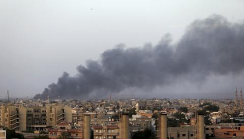 Plumes of black smoke is seen after clashes between the Benghazi Revolutionaries Shura Council and fighters of renegade general Khalifa Haftar, as they attempt to seize control of the airport from the council in Benghazi