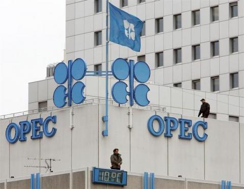 Police officers stand guard on the rooftop of Vienna's OPEC headquarters